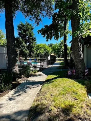a view of a swimming pool with a patio