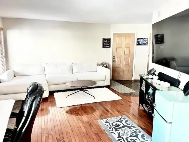 a living room with furniture and a rug