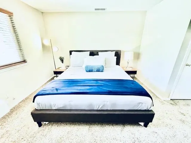 a bedroom with a bed and dresser