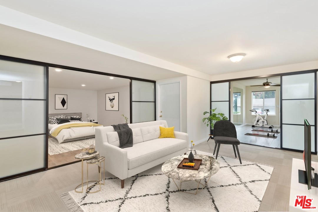 a living room with furniture and a rug