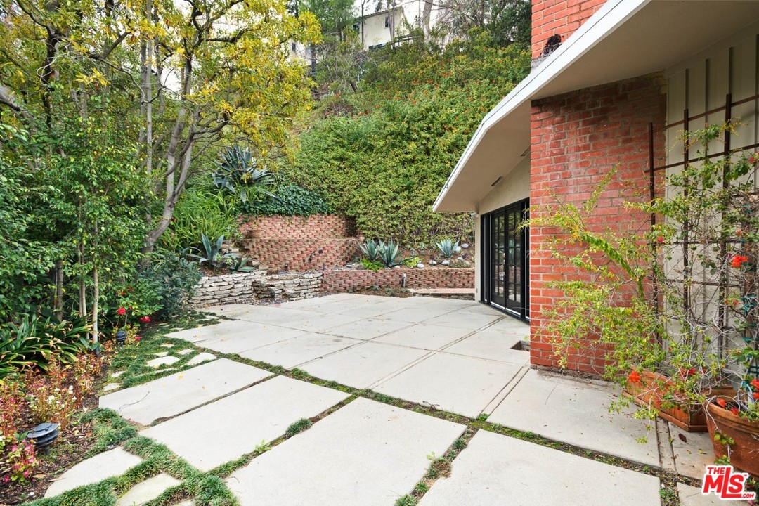 9614 Heather Road Beverly Hills, CA 90210 - Photo 20 of 25 a pathway of a house with backyard