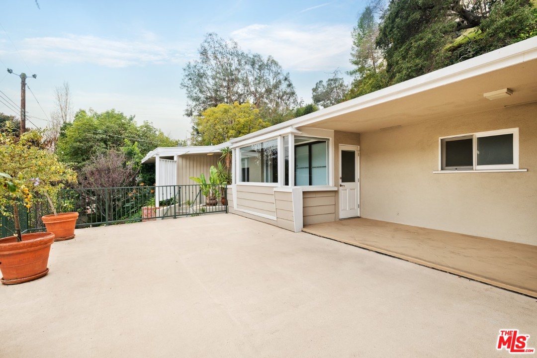 9614 Heather Road Beverly Hills, CA 90210 - Photo 25 of 25 a house with trees in front of it