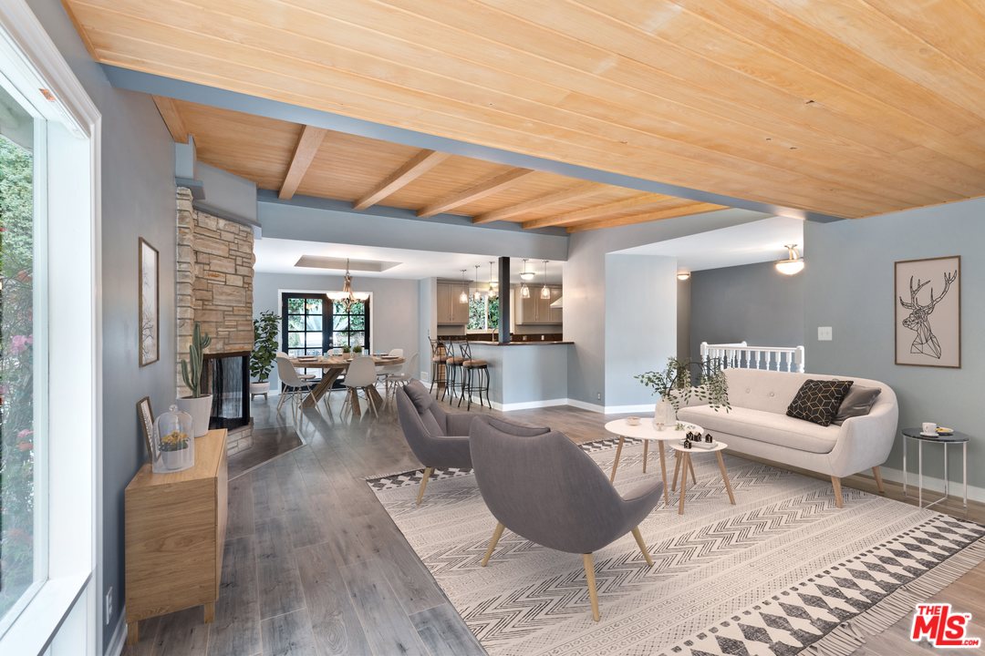 9614 Heather Road Beverly Hills, CA 90210 - Photo 4 of 25 a living room with furniture wooden floor and a table