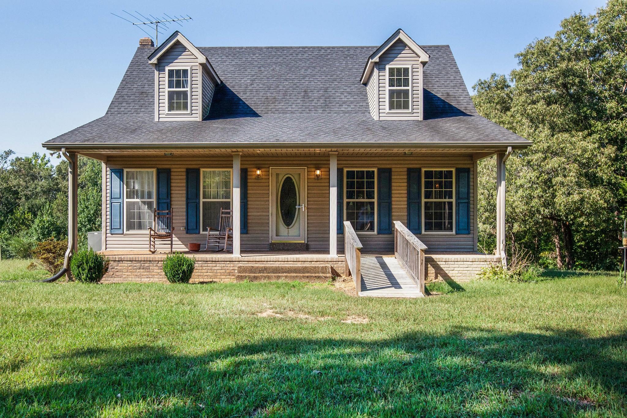8120 Primm Springs Road Primm Springs, TN 38476 - Photo 1 of 27 a view of a house with backyard porch and sitting area