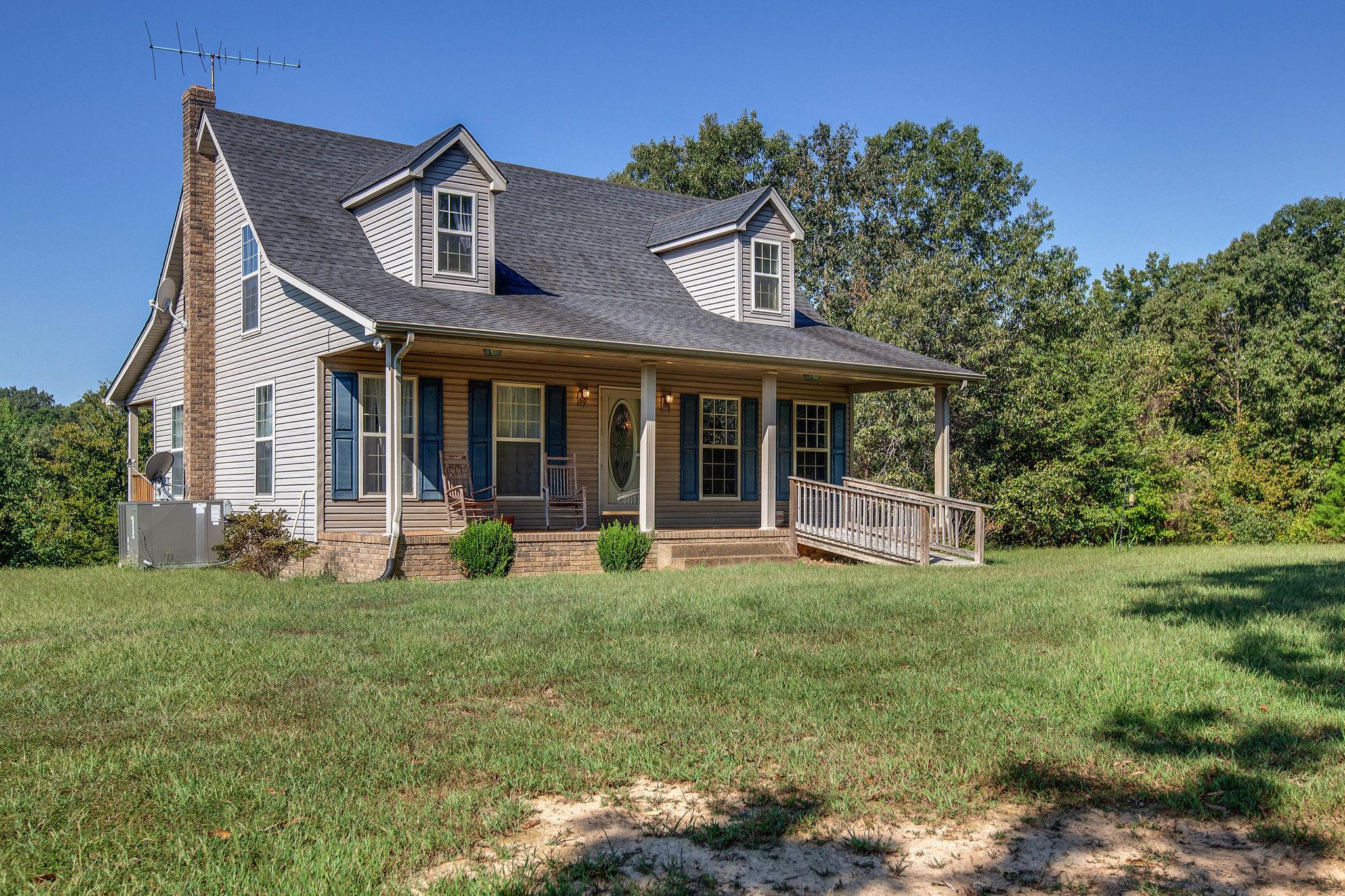 8120 Primm Springs Road Primm Springs, TN 38476 - Photo 2 of 27 front view of a house with a yard