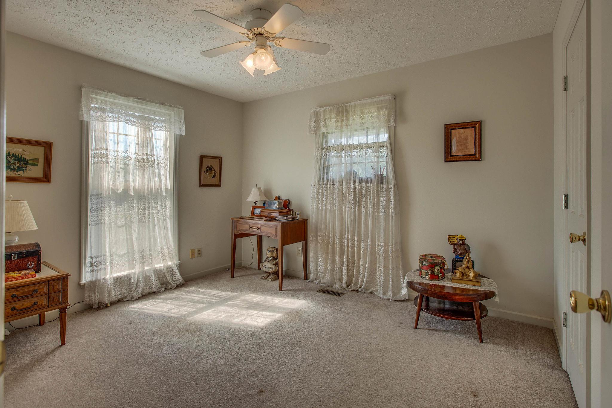 8120 Primm Springs Road Primm Springs, TN 38476 - Photo 14 of 27 a living room with furniture and a window