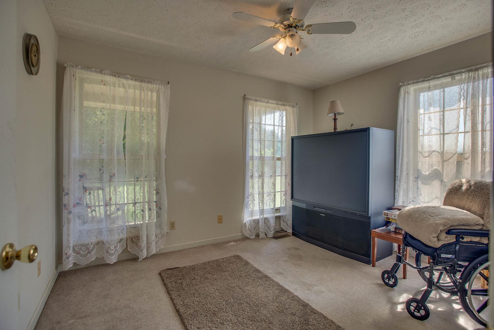 8120 Primm Springs Road Primm Springs, TN 38476 - Photo 15 of 27 a living room with furniture and a window