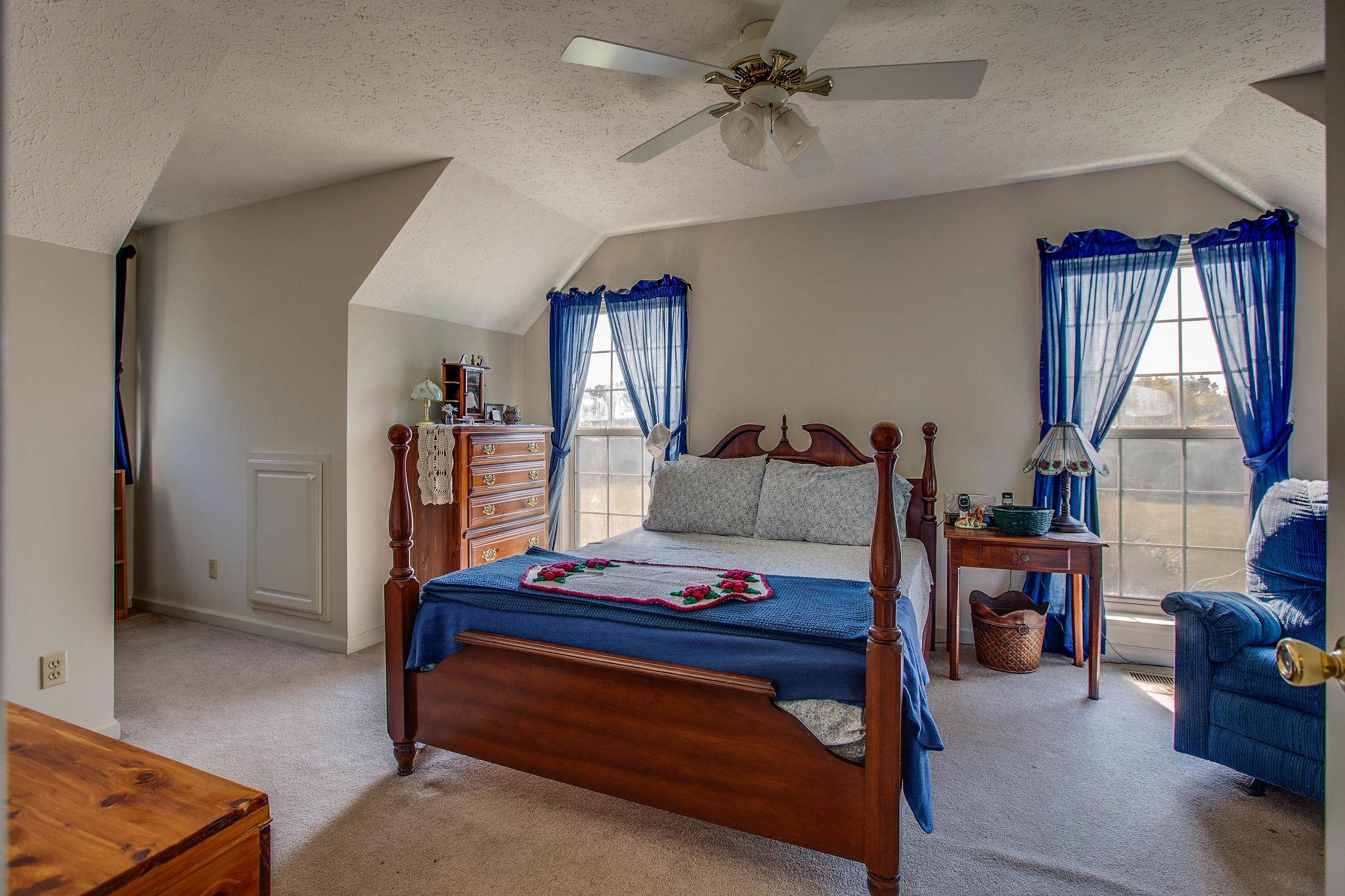 8120 Primm Springs Road Primm Springs, TN 38476 - Photo 17 of 27 a bedroom with furniture and a window