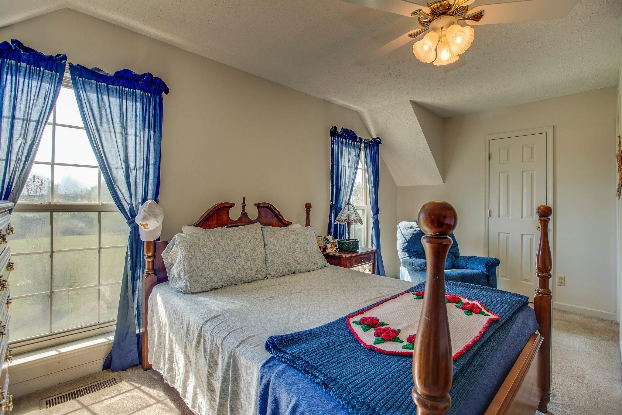 8120 Primm Springs Road Primm Springs, TN 38476 - Photo 18 of 27 a bedroom with bed and a window