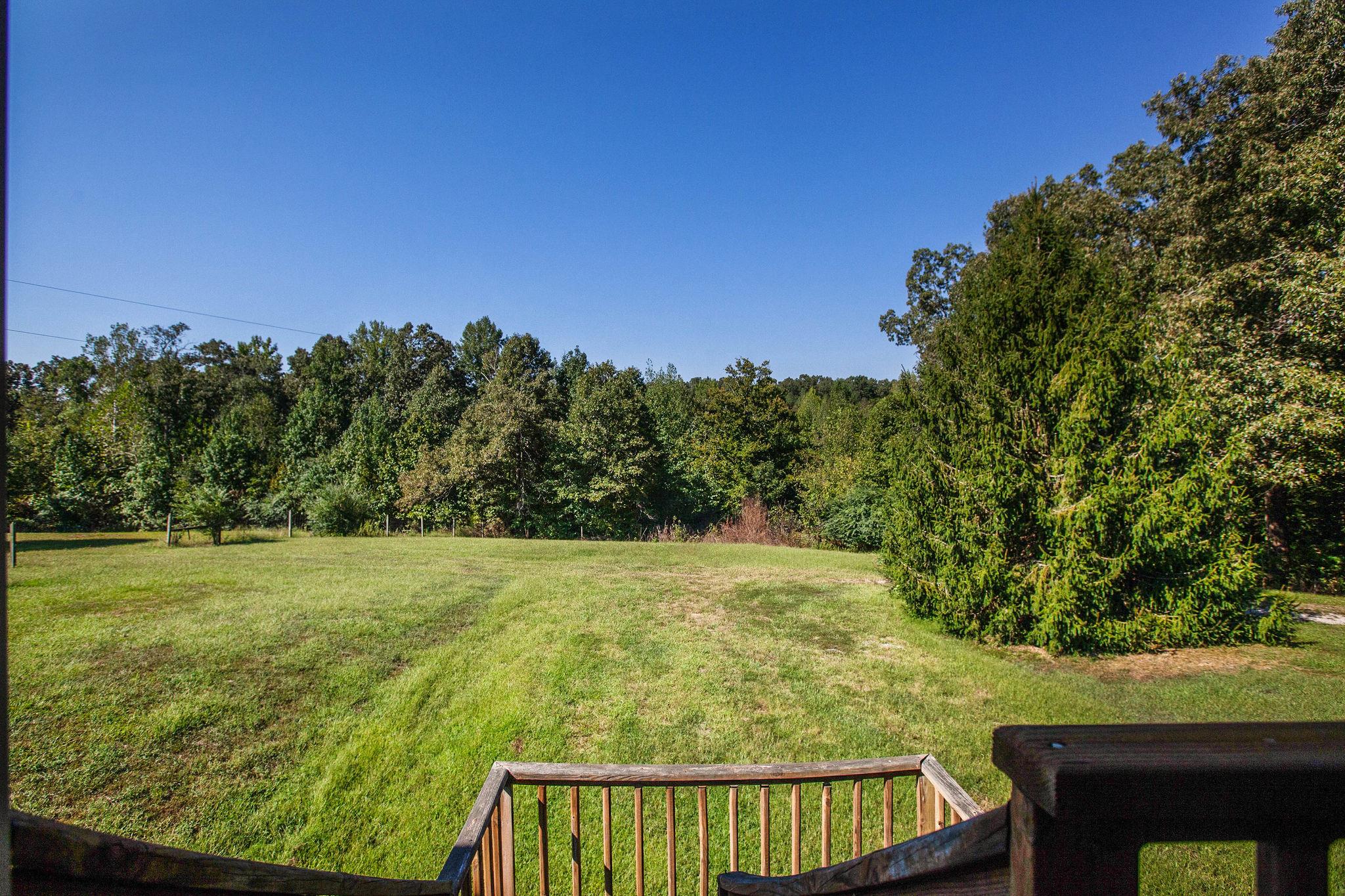 8120 Primm Springs Road Primm Springs, TN 38476 - Photo 26 of 27 a view of a yard with wooden fence