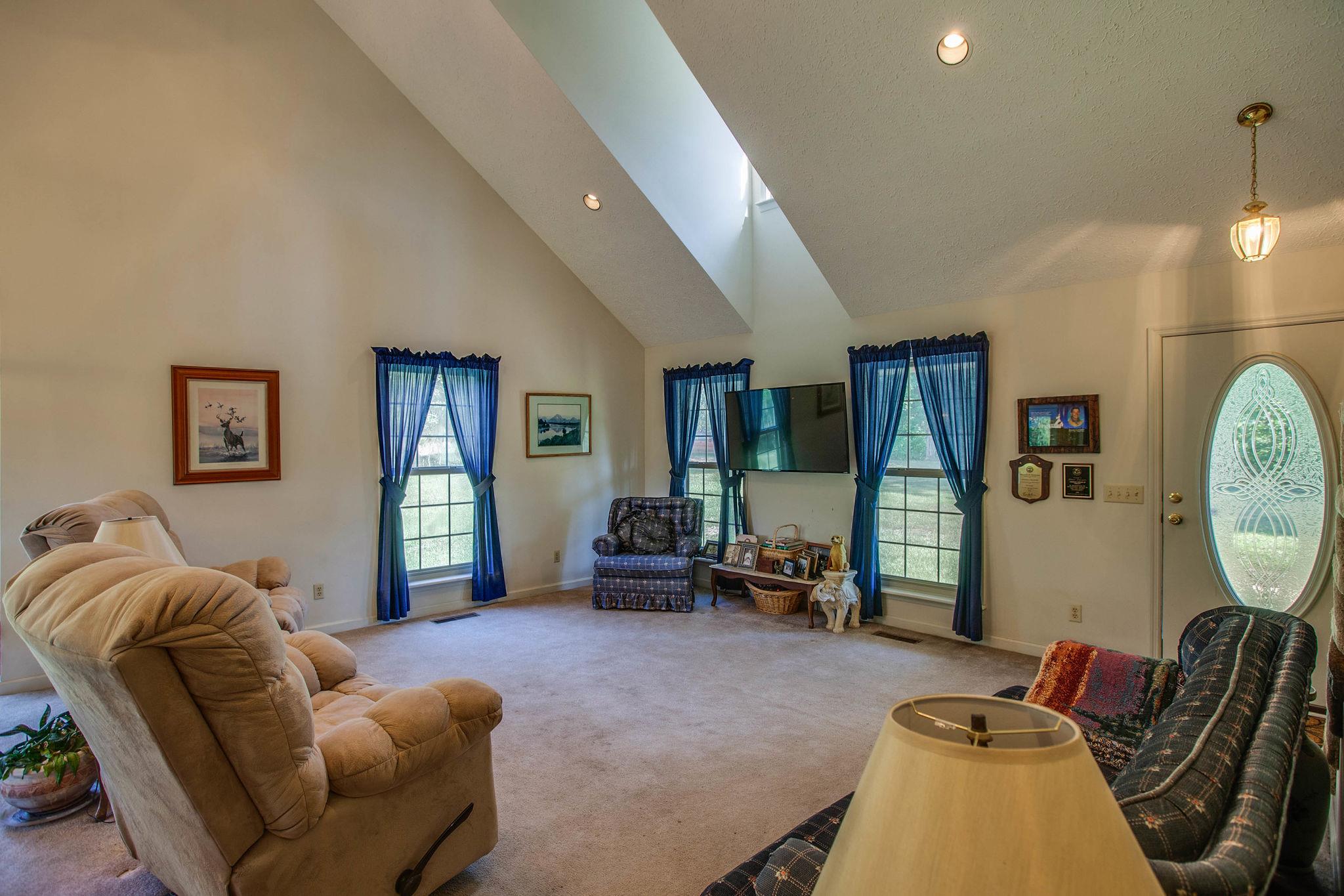 8120 Primm Springs Road Primm Springs, TN 38476 - Photo 8 of 27 a living room with furniture chess board and a window