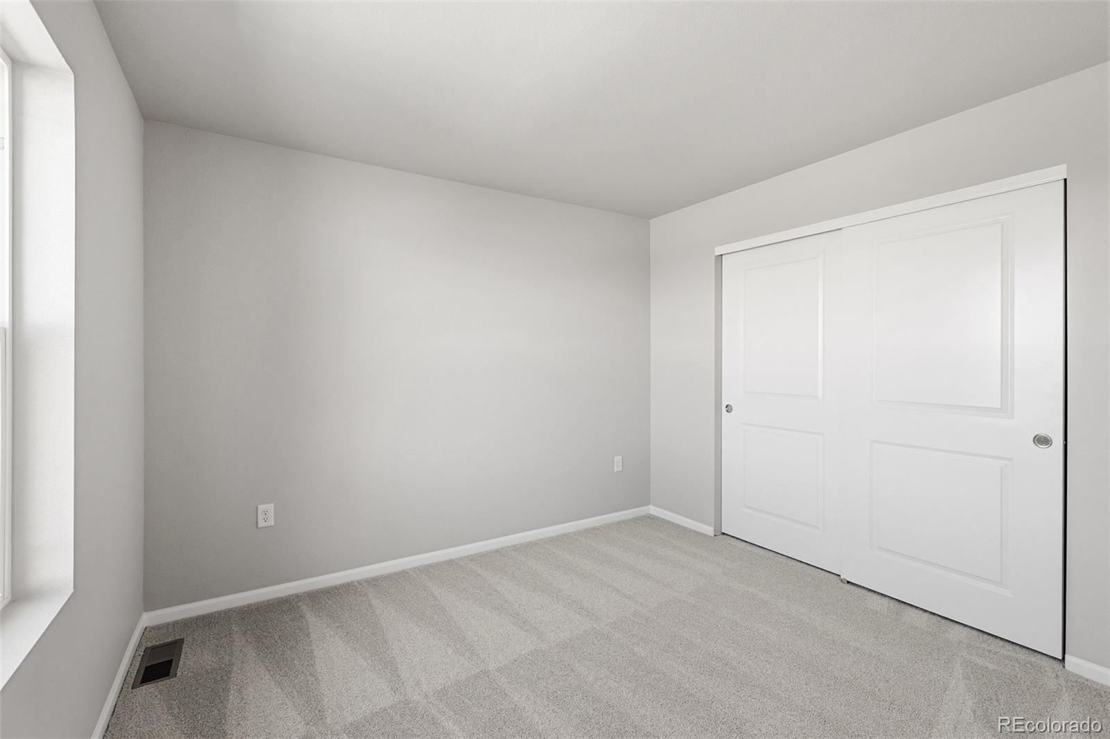 15293 Olive Way Thornton, CO 80602 - Photo 23 of 29 a view of an empty room