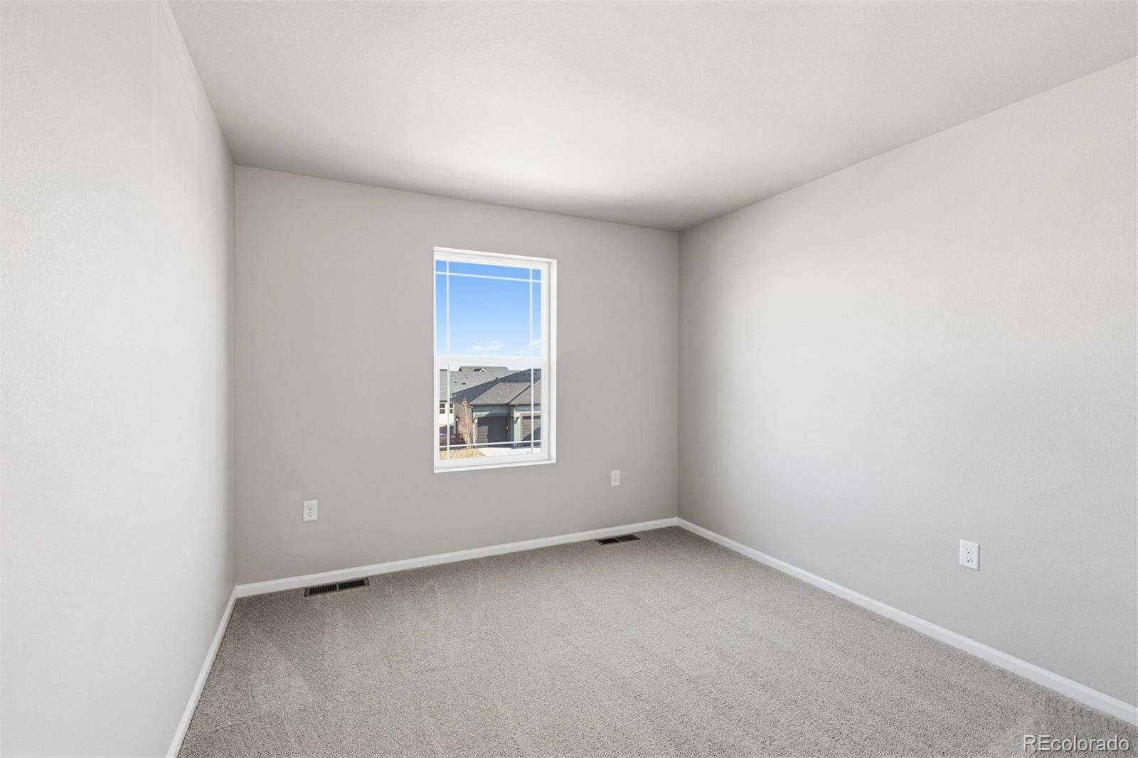 15293 Olive Way Thornton, CO 80602 - Photo 24 of 29 an empty room with a window