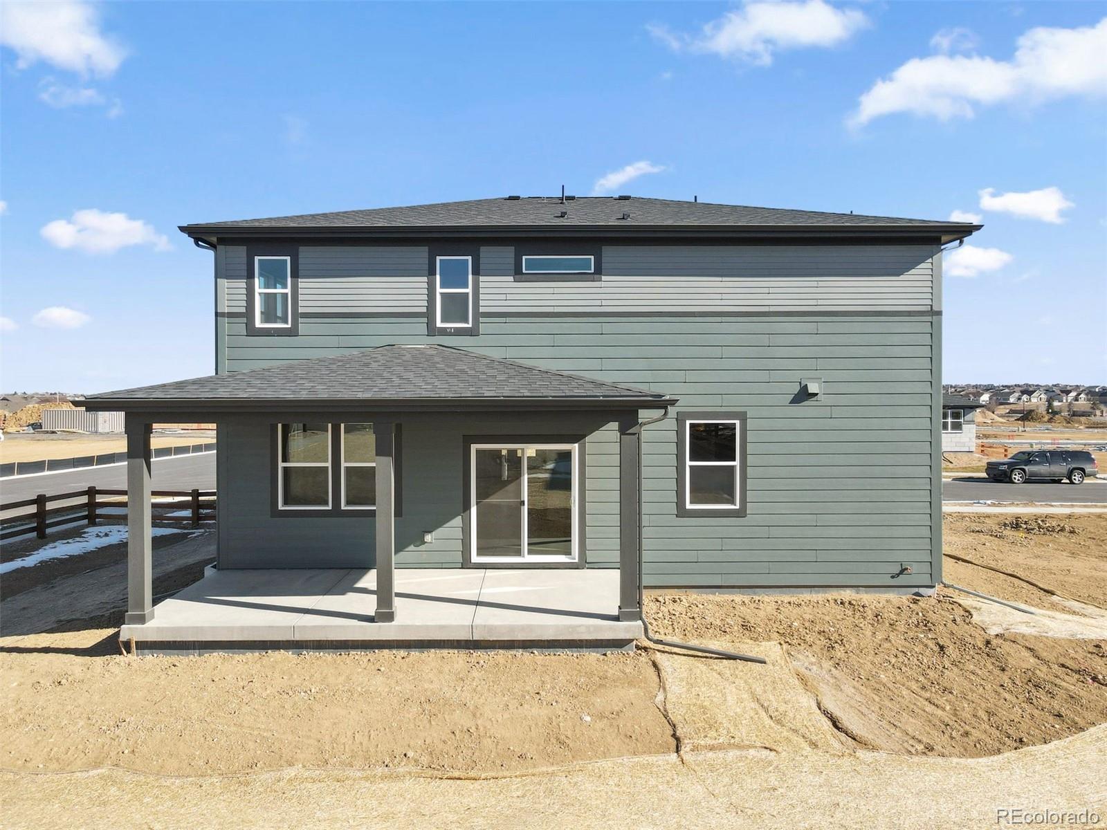 15293 Olive Way Thornton, CO 80602 - Photo 26 of 29 a front view of a house