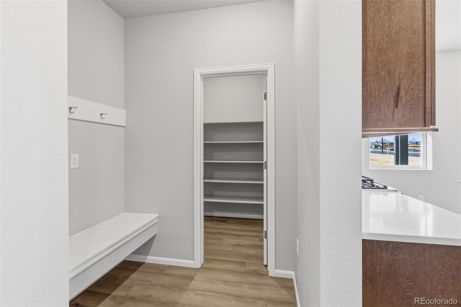 15293 Olive Way Thornton, CO 80602 - Photo 5 of 29 a view of walk in closet with empty racks