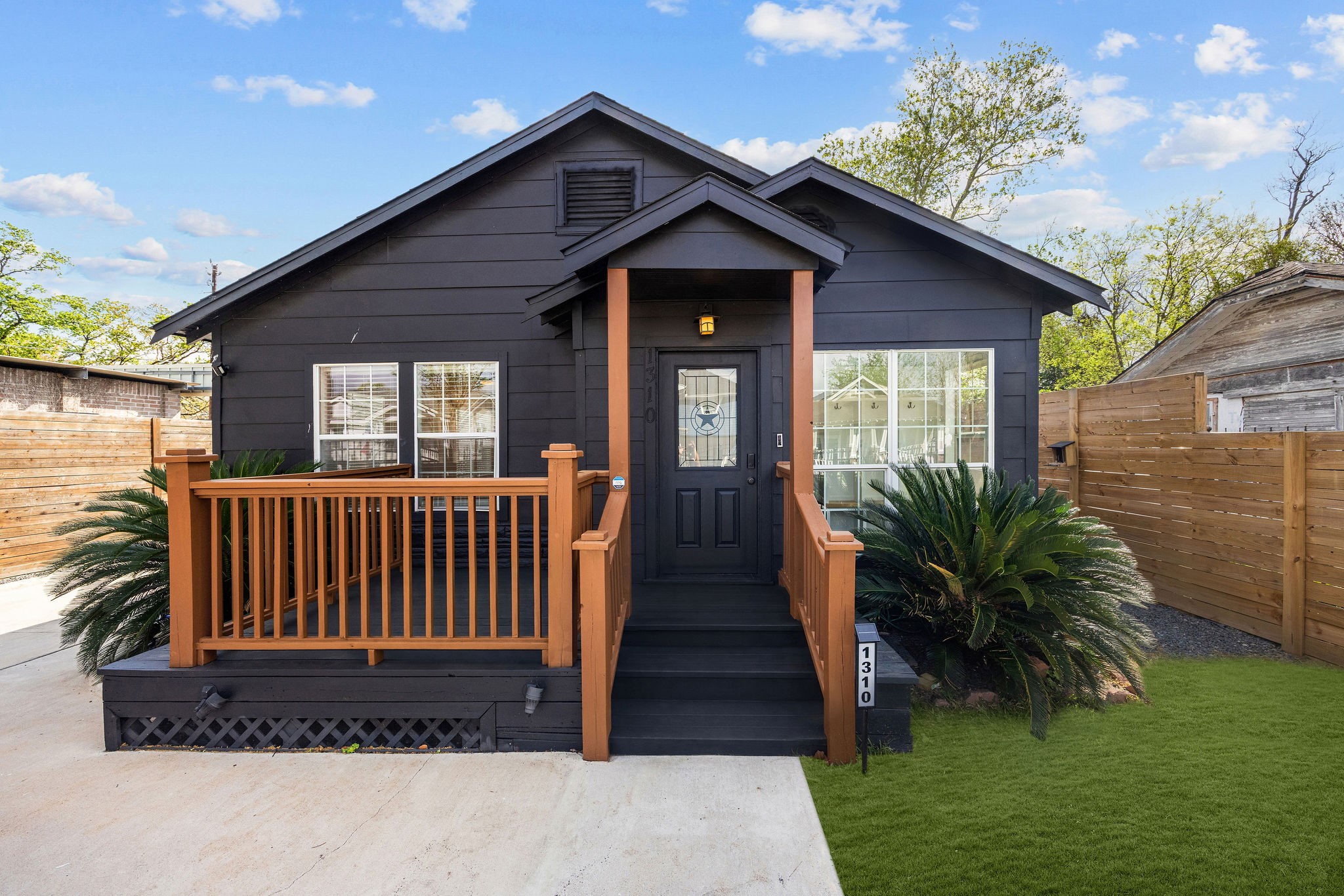 1310 Walton Street Houston, TX 77009 - Photo 1 of 19 Charming front elevation featuring elevated porch, custom railing, and great curb appeal.