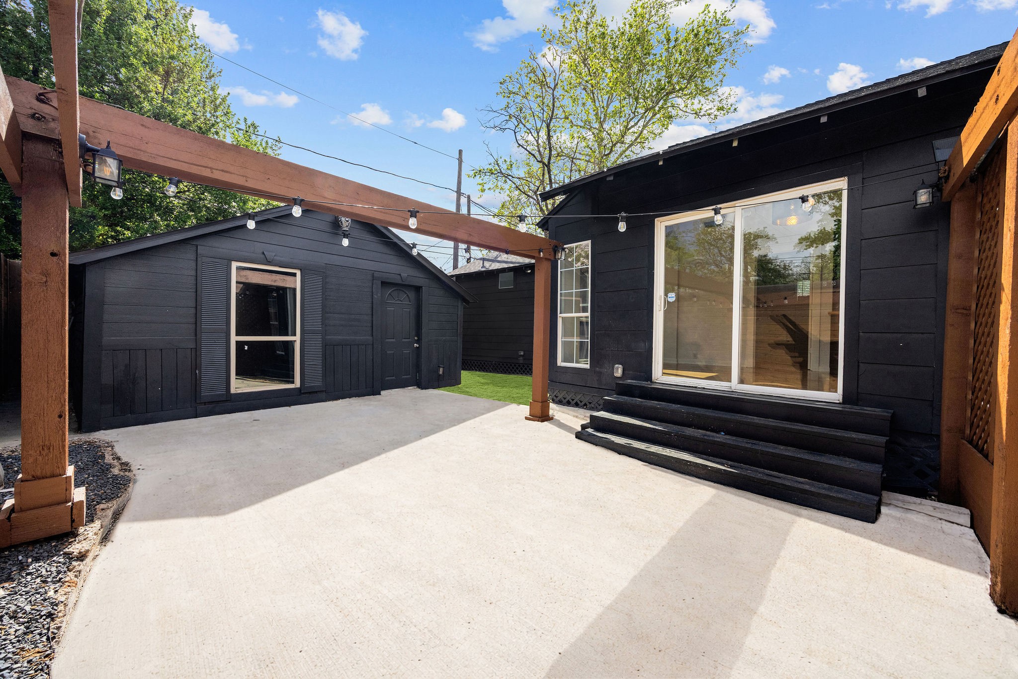 1310 Walton Street Houston, TX 77009 - Photo 16 of 19 Private backyard with patio, pergola, and detached structure for flexible use.