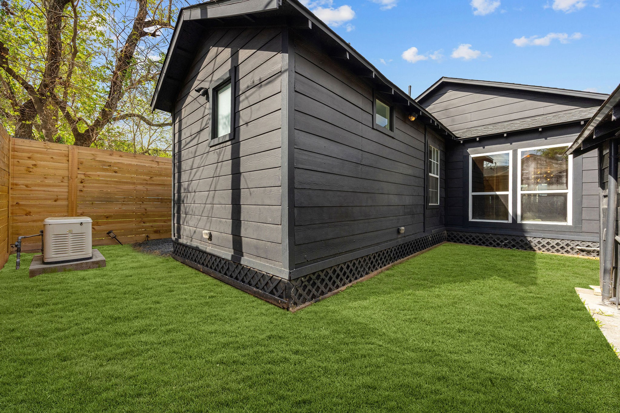 1310 Walton Street Houston, TX 77009 - Photo 17 of 19 Private yard space with fresh landscaping and room to enjoy outdoor living.