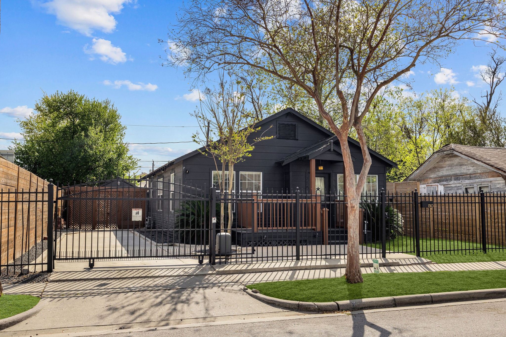 1310 Walton Street Houston, TX 77009 - Photo 19 of 19 Fully gated property with private driveway, manicured landscaping, and secure front entry.