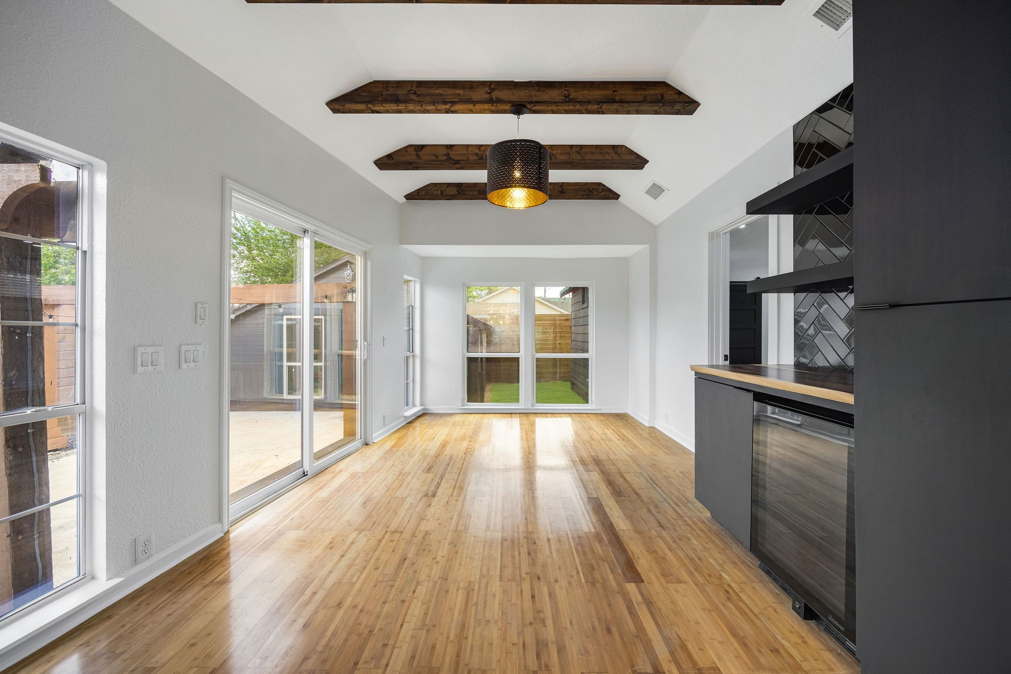 1310 Walton Street Houston, TX 77009 - Photo 8 of 19 Open layout showcasing seamless flow between kitchen, dining, and living spaces.