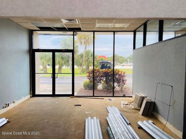 1890 Palm Bay Road Northeast, Unit 2 Palm Bay, FL 32905 - Photo 2 of 8 a view of a living room and floor to ceiling window