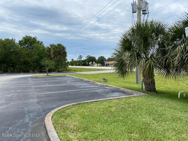 1890 Palm Bay Road Northeast, Unit 2 Palm Bay, FL 32905 - Photo 6 of 8 a view of a swimming pool with a yard
