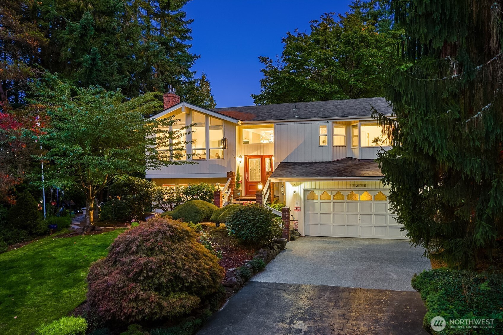 1616 175th Place Southeast Bothell, WA 98012 - Photo 1 of 37 a view of a house with a small yard and floor to ceiling window