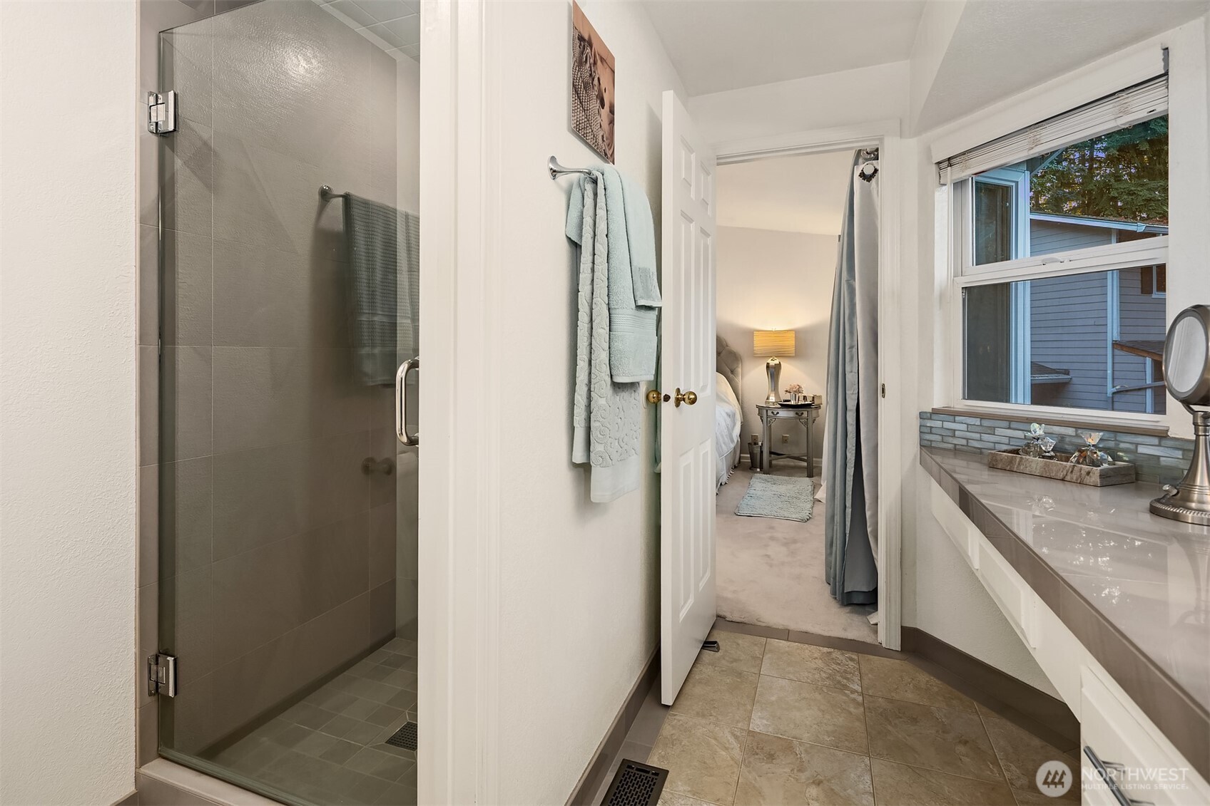1616 175th Place Southeast Bothell, WA 98012 - Photo 13 of 37 a view of a hallway with a livingroom and a bathroom with a sink