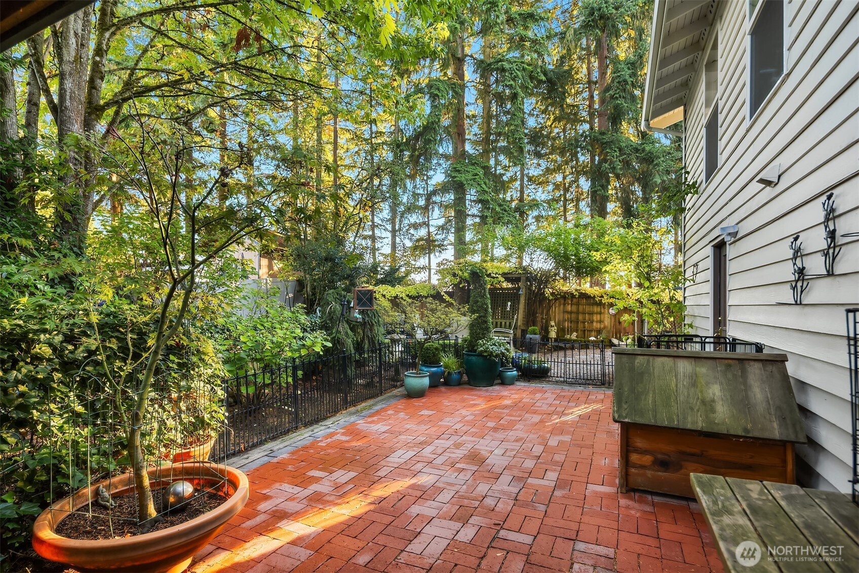 1616 175th Place Southeast Bothell, WA 98012 - Photo 23 of 37 a backyard of a house with fountain table and chairs