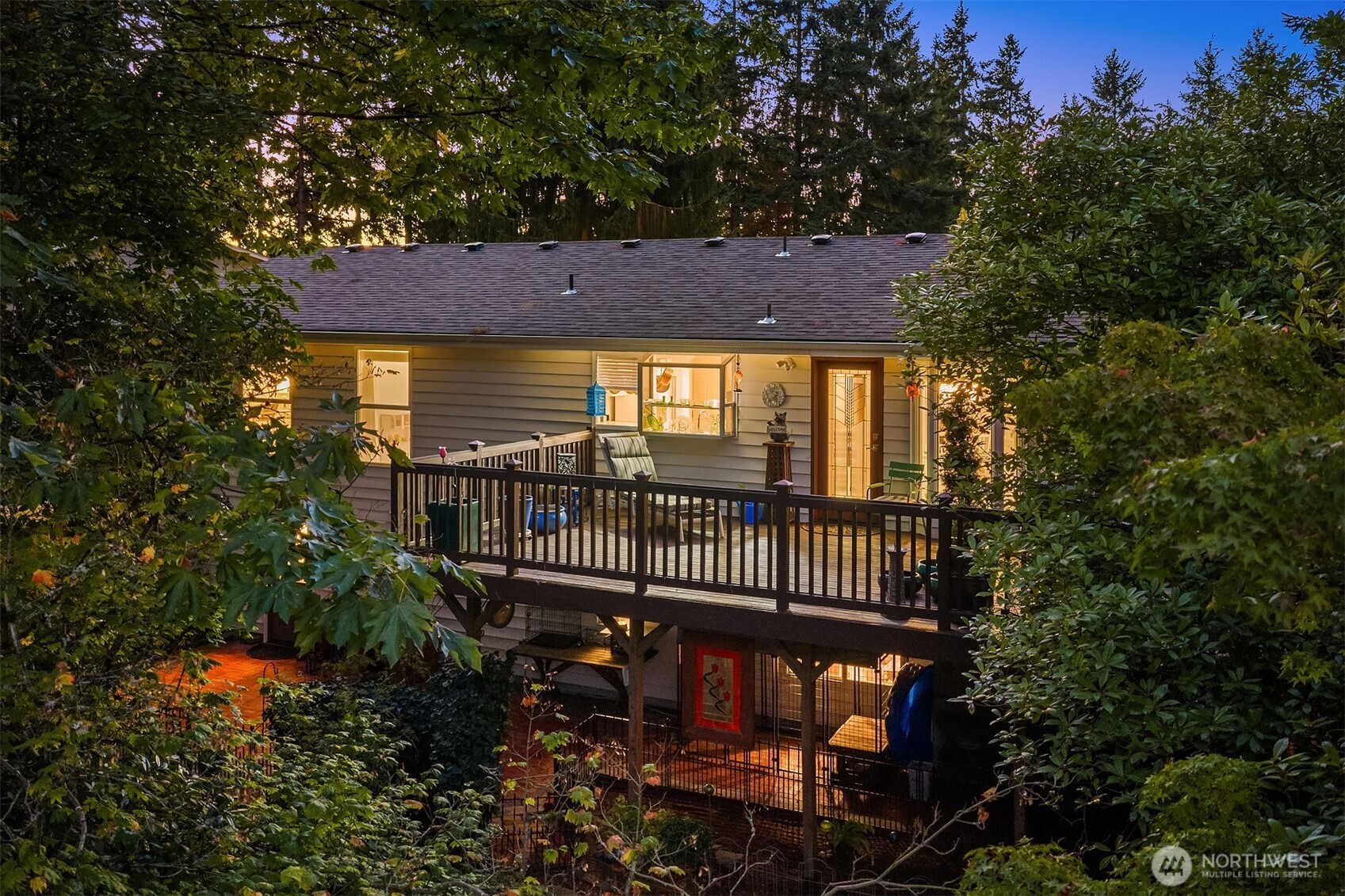 1616 175th Place Southeast Bothell, WA 98012 - Photo 34 of 37 a view of a brick house with a small yard and wooden fence