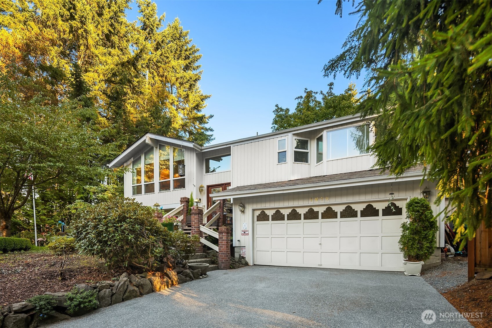 1616 175th Place Southeast Bothell, WA 98012 - Photo 36 of 37 a front view of a house with a yard and garage