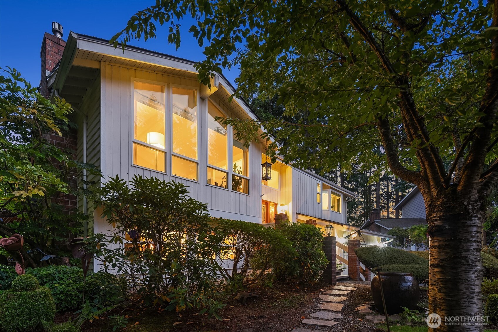 1616 175th Place Southeast Bothell, WA 98012 - Photo 4 of 37 a view of a house with a tree and plants