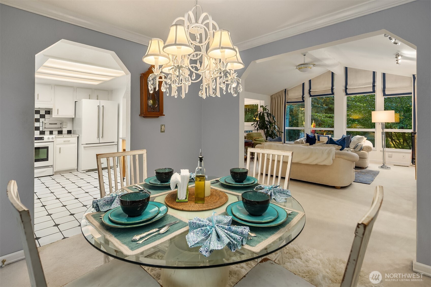 1616 175th Place Southeast Bothell, WA 98012 - Photo 8 of 37 a view of a dining room with furniture a chandelier and wooden floor