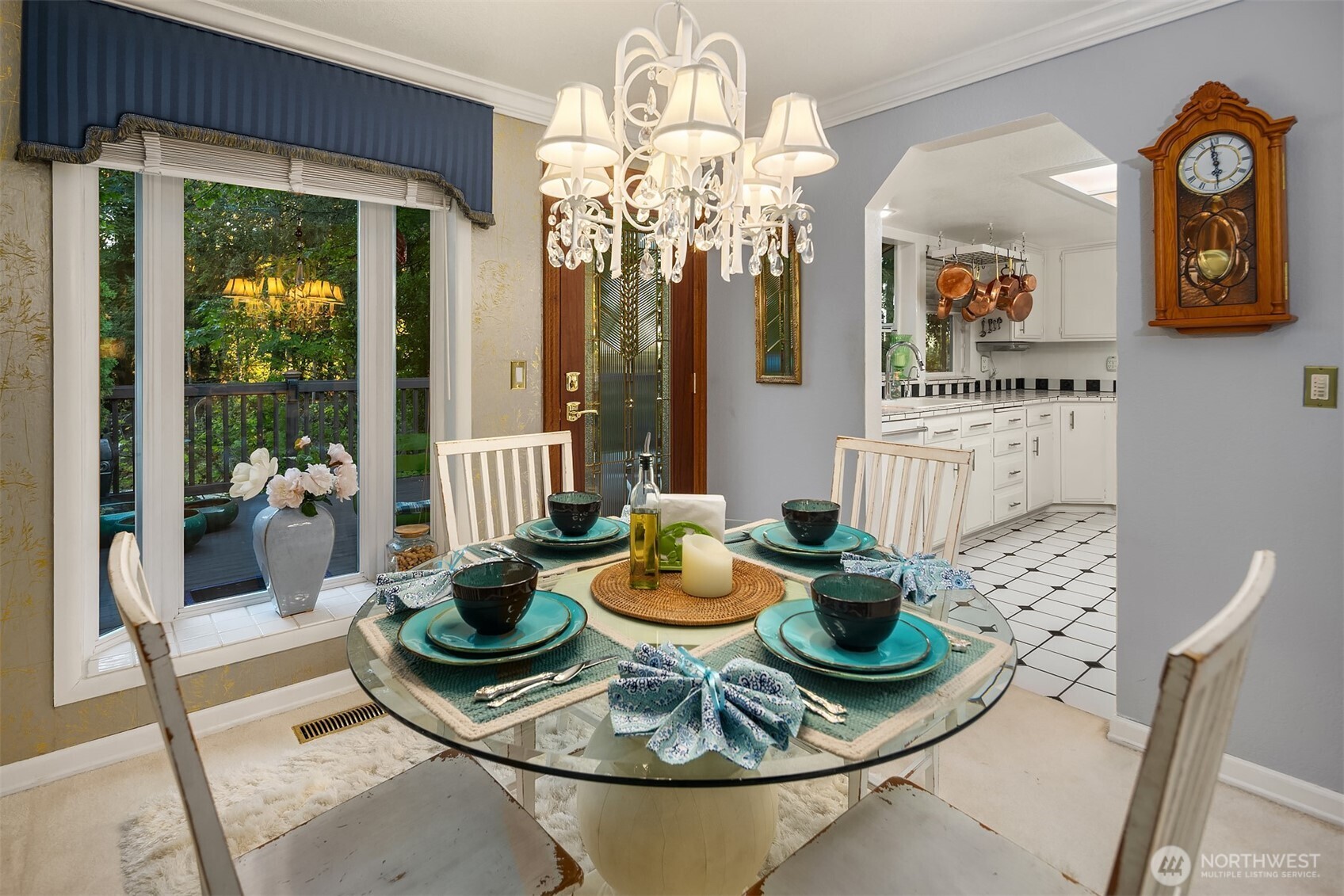 1616 175th Place Southeast Bothell, WA 98012 - Photo 9 of 37 a dining room with furniture a potted plant and a chandelier