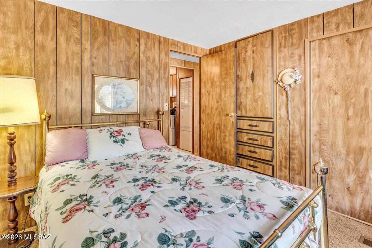 5840 West Flying W Street Tucson, AZ 85713 - Photo 22 of 38 a bedroom with a bed and a dresser