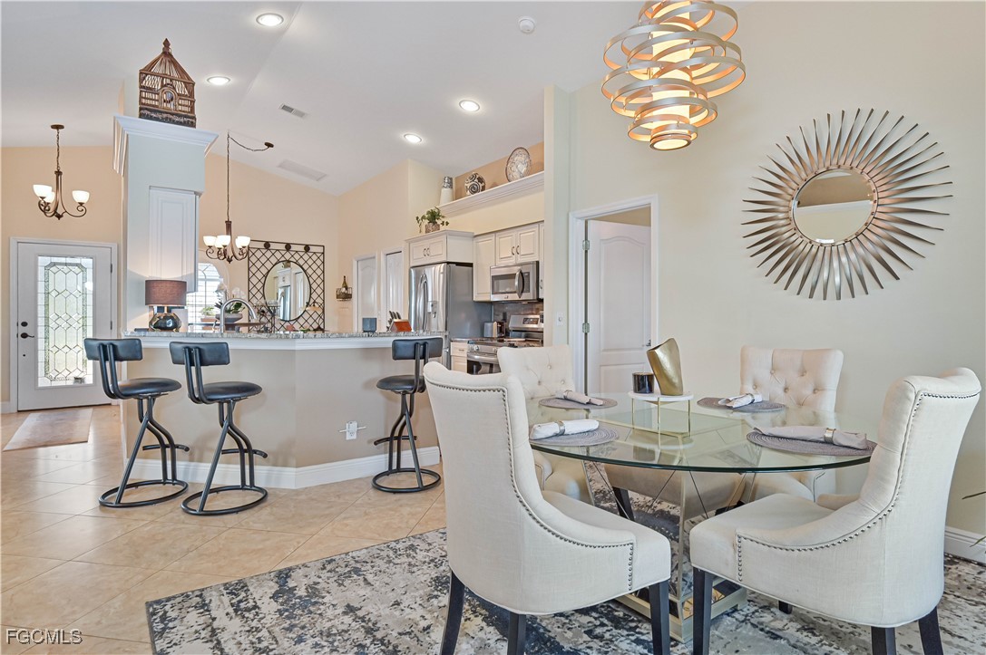 21593 Windham Run Estero, FL 33928 - Photo 17 of 49 a view of a dining room with furniture