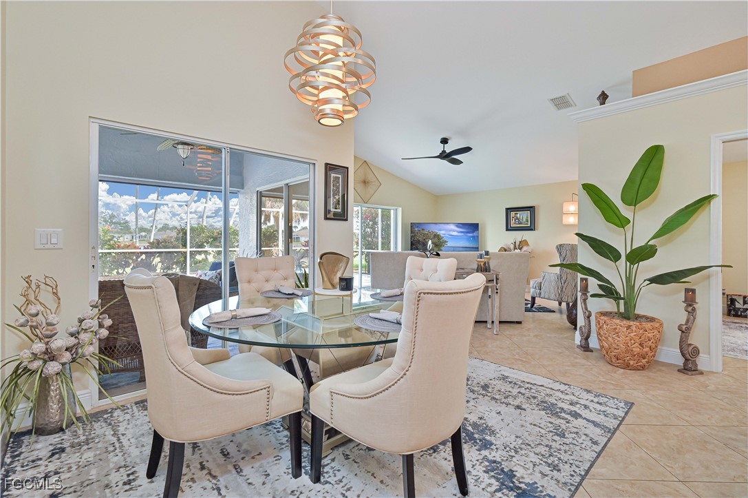 21593 Windham Run Estero, FL 33928 - Photo 18 of 49 a view of a dining room with furniture window and wooden floor