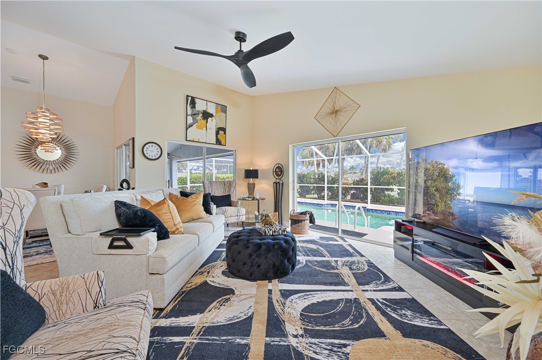 21593 Windham Run Estero, FL 33928 - Photo 20 of 49 a living room with furniture a flat screen tv and a large window