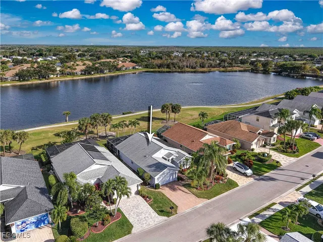 an aerial view of a house with a lake view