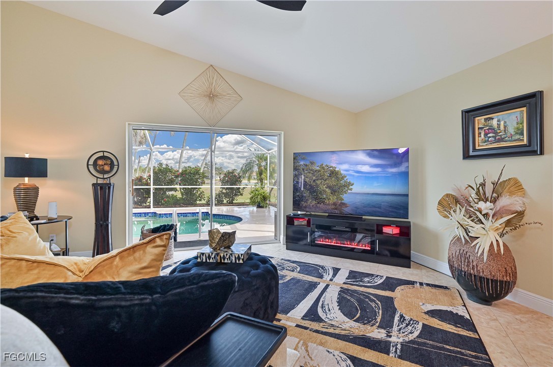 21593 Windham Run Estero, FL 33928 - Photo 21 of 49 a living room with furniture a rug and a flat screen tv