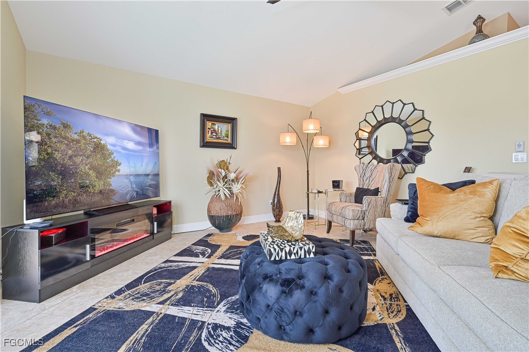 21593 Windham Run Estero, FL 33928 - Photo 22 of 49 a living room with furniture and a flat screen tv