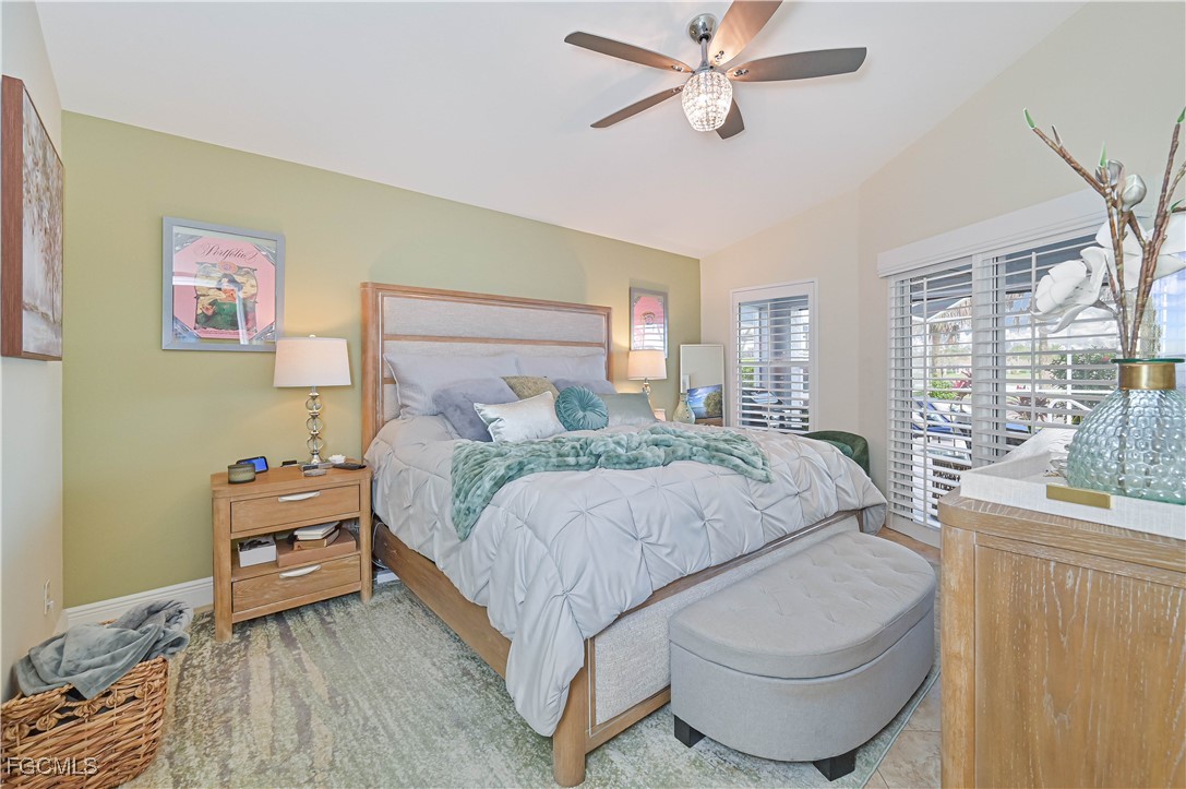 21593 Windham Run Estero, FL 33928 - Photo 27 of 49 a bedroom with a bed and wooden floor