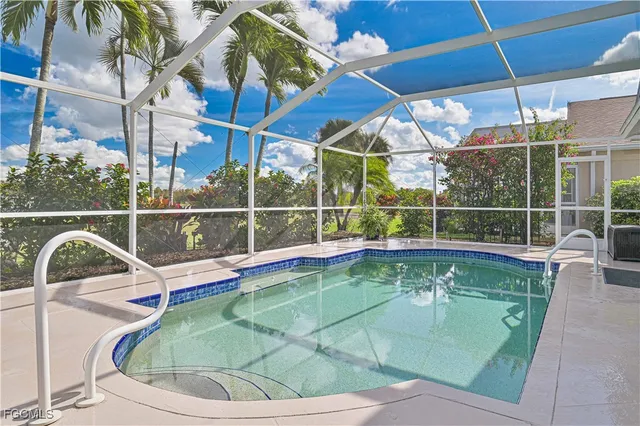 a view of a swimming pool with a porch