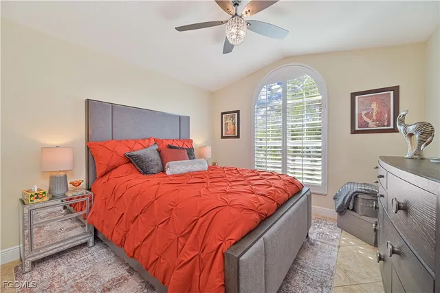 a bed room with a bed and a chandelier