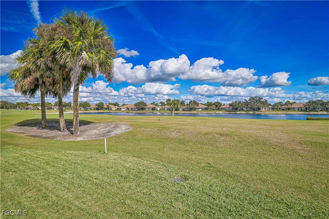 21593 Windham Run Estero, FL 33928 - Photo 36 of 49 a view of a lake with houses in the back