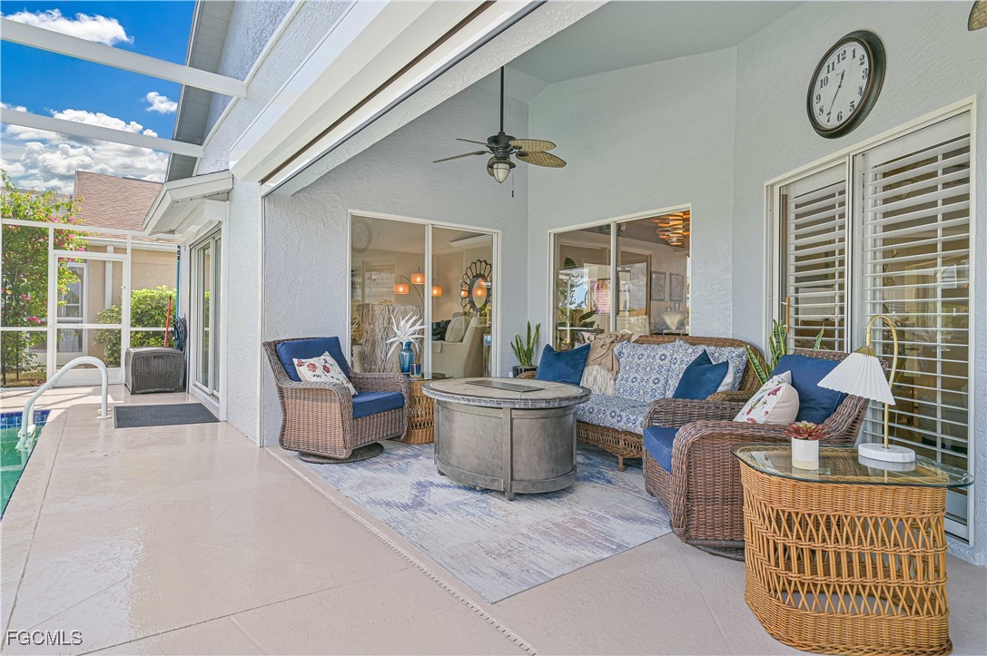 21593 Windham Run Estero, FL 33928 - Photo 4 of 49 a living room with furniture a window and a clock