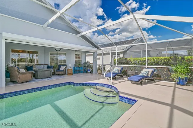 a view of a backyard with swimming pool