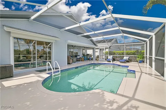 a view of a swimming pool with a patio