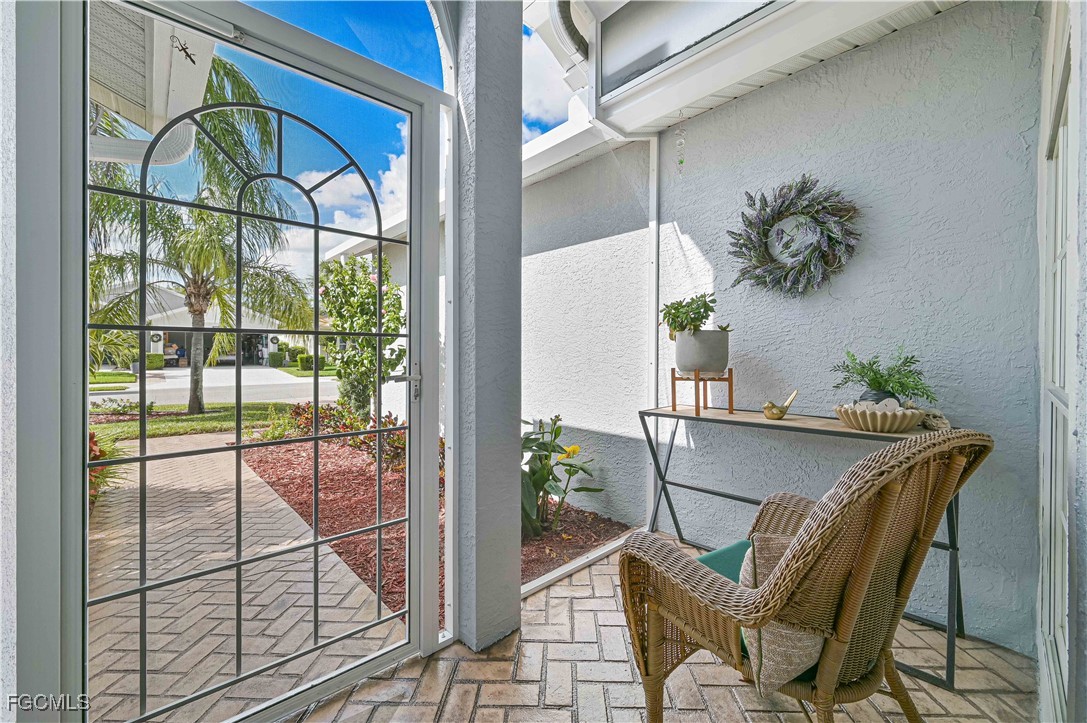 21593 Windham Run Estero, FL 33928 - Photo 9 of 49 a dining room with furniture and floor to ceiling window