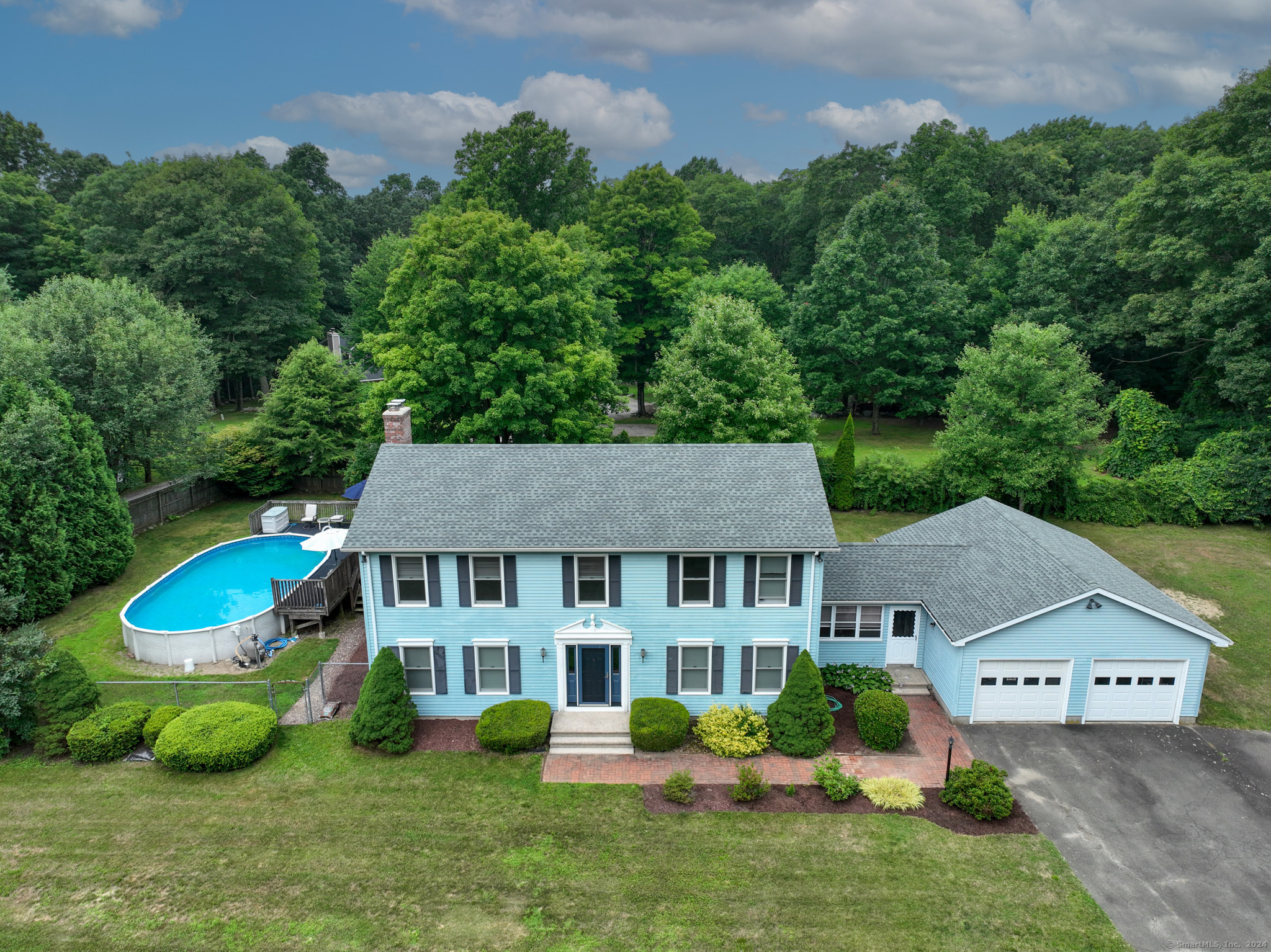 141 Burr Road Haddam, CT 06441 - Photo 1 of 1 an aerial view of a house with swimming pool and garden